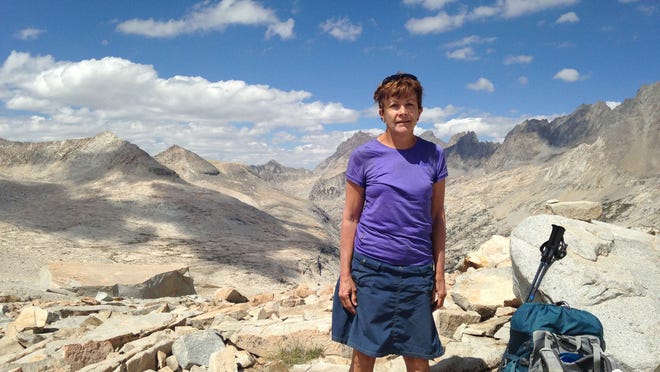 Solo hiker Debbie Good of Springfield takes in the view on a high pass on the John Muir Trail high in California's Sierra Nevada mountains.