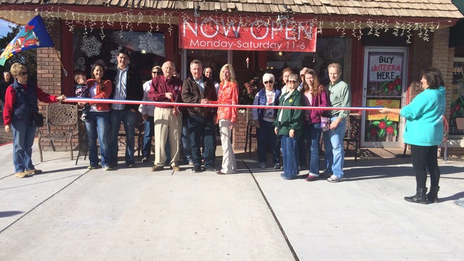 Parowan Mayor Don Landes cuts the ribbon Saturday morning at the grand opening of Renew. Owner Mollie Bates said her goal with the store is to “reintroduce old things to the younger generation.”