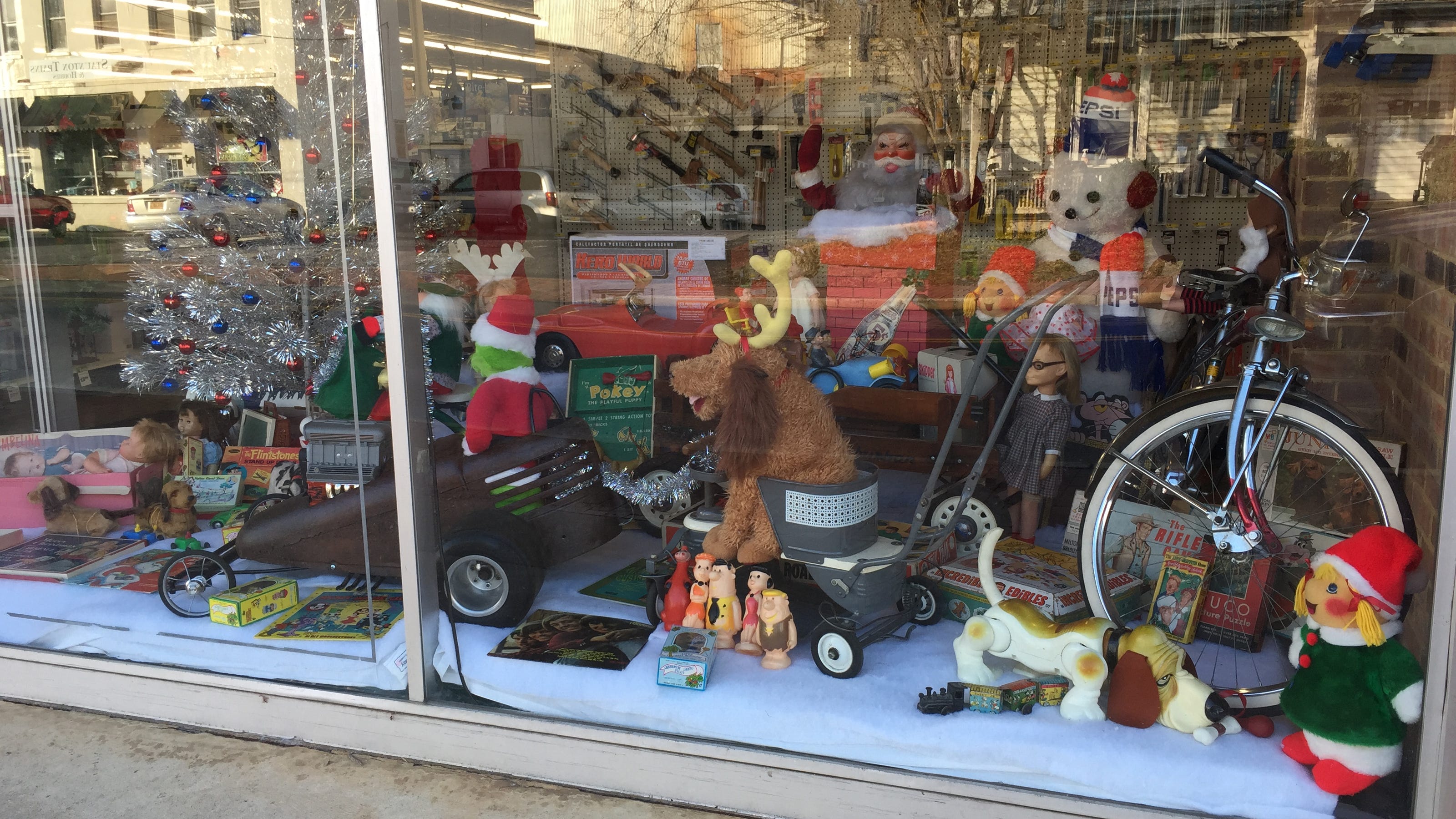 Customer creates unique toy displays for store window