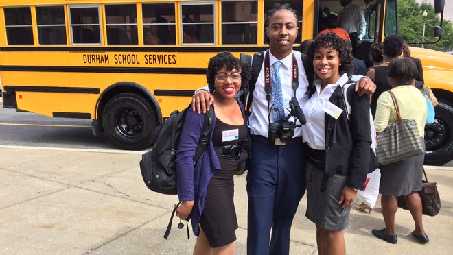 
Three DSU students, from left, Kristyn Green, Jonpaul Brown and Jacquaniese Washington, prepare to board a bus bound for Richmond from Washington, D. C., on Wednesday to commemorate the 50th anniversary of President Lyndon B. Johnson signing the Civil Rights Act of 1964.

