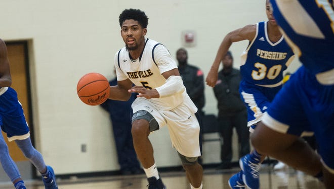 East English Village Prep point guard and Michigan signee David DeJulius moves with the ball during East English Village Prep's game against Pershing High School on Tuesday, Jan. 9, 2018 at East English Village Preparatory Academy in Detroit. East English Village Prep defeated Pershing High School 62-53.