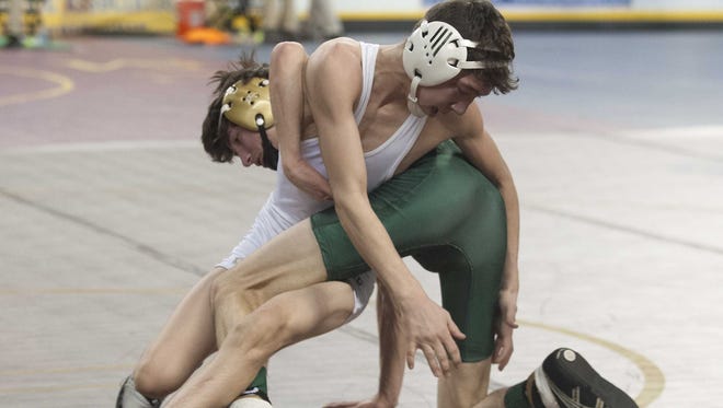 Seneca's Joe Manchio, right, wrestles Passaic Valley's Kenny Kerwin during a 106-pound bout on Friday in the NJSIAA state tournament's first round at Boardwalk Hall in Atlantic City. Manchio won, 10-1.