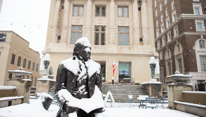 The statue of Joel Poinsett in downtown Greenville is covered with snow on Wednesday, January 17, 2018.