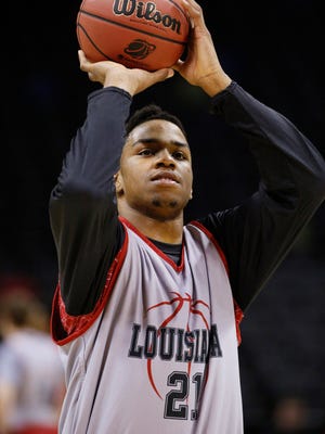 UL forward Shawn Long (21) shoots during practice before the second round of the 2014 NCAA Tournament at AT&T Center.