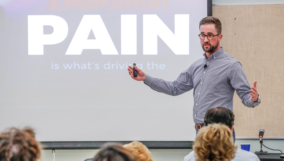 Austin Eubanks, a survivor of the Columbine school shooting speaks about addiction resulting from trauma during the the 11th Annual Susan Li Conference at Hope Academy Recovery High School in Indianapolis on Thursday, July 19, 2018. 