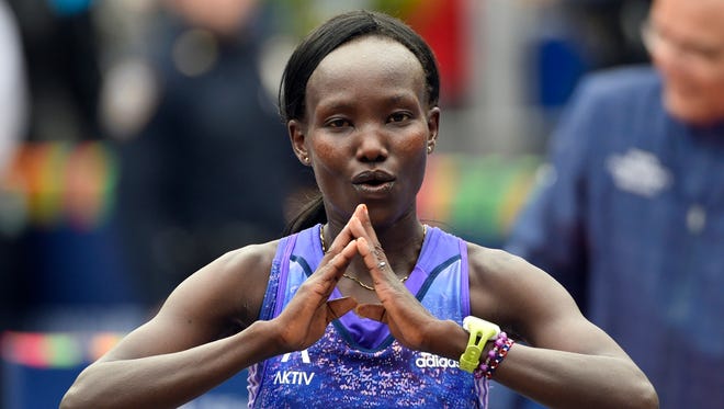 Mary Keitany reacts after crossing the finish line to win the women's division of  the 2015 TCS New York City Marathon on Nov. 1.