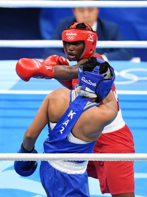Claressa Shields, shown winning gold for the USA in the 2016 Olympics, will make her pro debut Nov. 19.