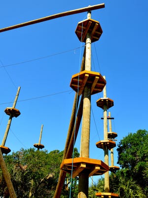 Matthew and Kelly VanDenBeldt have been working hard, building Cocoa Beach Aerial Adventures in Cape Canaveral in the woods  between The Dollar Store and Sunseed Food Co-op, preserving all the live oak trees on site. Soome of the platforms are 40 feet in the air. 