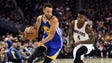 Stephen Curry drives to the basket against Iman Shumpert