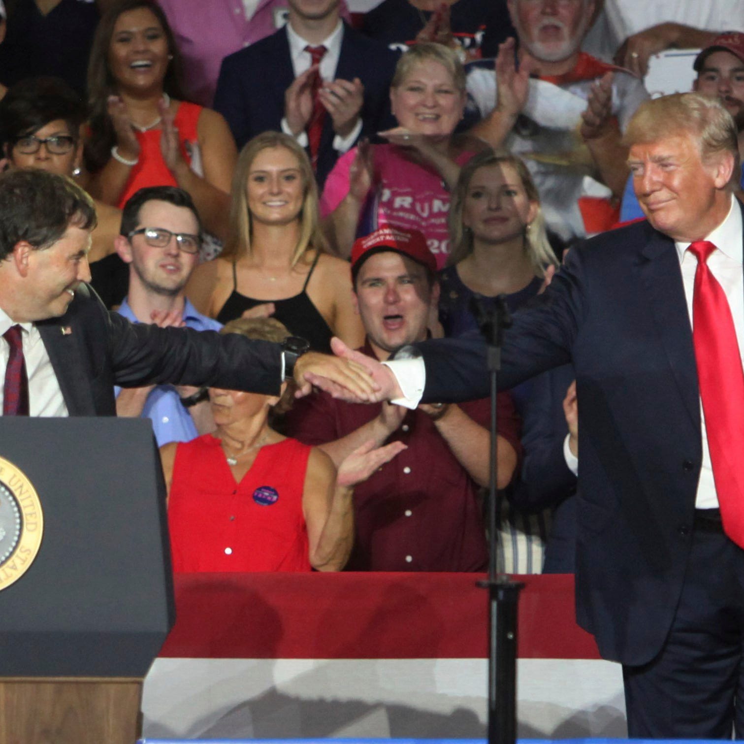 12th Congressional District Republican candidate Troy Balderson, left, shakes hands with President Donald Trump during a rally, Saturday, Aug. 4, 2018, in Lewis Center, Ohio.