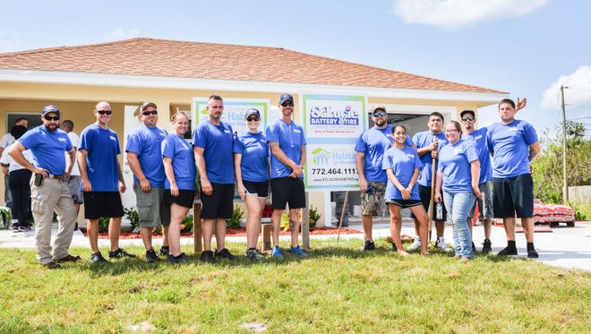 St. Lucie Battery & Tire Car Care Center employees recently gave up a Saturday to install sod and mulch and plant shrubs at a Port St. Lucie Habitat for Humanity home.
