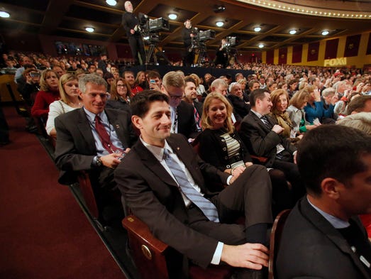 Ryan sits in the audience before the Republican presidential
