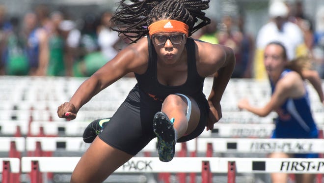 Dunbar High School's Te'Niya Jones competes in the girls 100-meter hurdles at the Lee County Athletic Conference Championship, Saturday (3/21/15) at South Fort Myers High School.