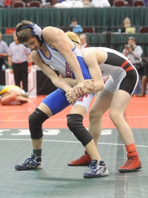 Zane Trace's Jordan Hoselton and Akron Manchester's Zack Larue compete in their 106-pound match during the 2016 Division III State Wrestling Tournament in Columbus.