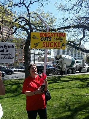 "Education cuts really suck," reads at sign from teacher demonstrations at the Colorado Capitol Friday, April 27, 2018.