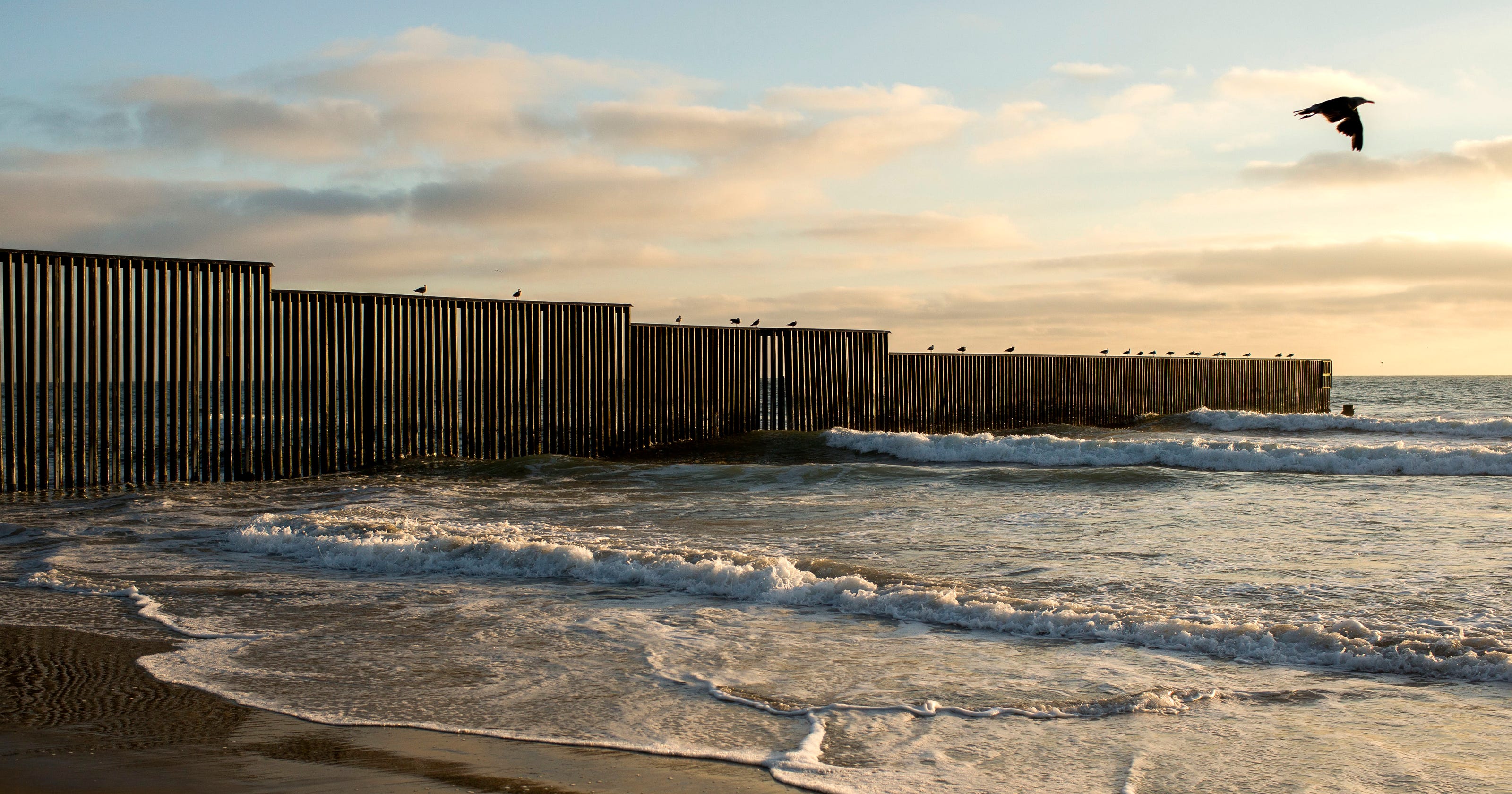 How much of the border already has a wall or a fence?