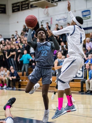 South Burlington's Hakeem Fuad drives to the hoop against Burlington during Friday night's boys basketball game at Buck Hard Gym.