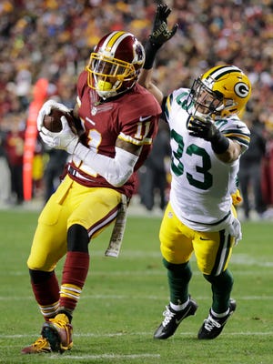 Washington receiver DeSean Jackson scores a touchdown reception past Green Bay Packers safety Micah Hyde in the first quarter Sunday, November 20, 2016, at FedEx Field in Landover, Maryland.