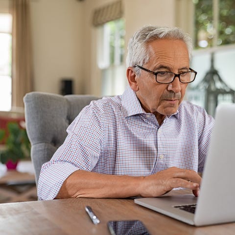 A person at a laptop.