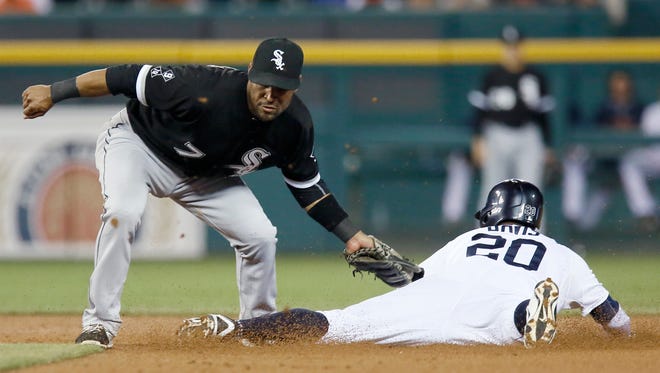 Second baseman Micah Johnson of the Chicago White Sox tags out Rajai Davis of the Detroit Tigers trying to steal second base during the third inning of Game 2 of a double-header at Comerica Park on September 21, 2015 in Detroit.
