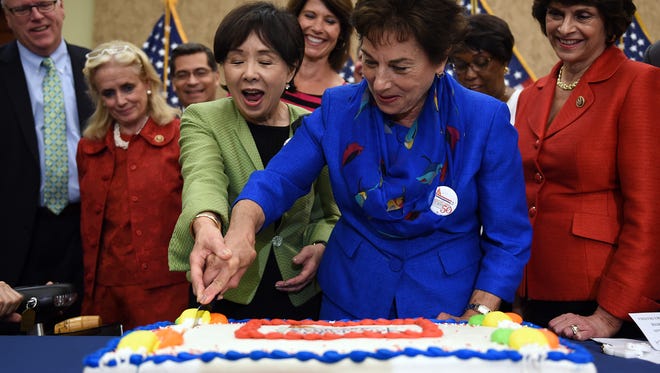 Rep. Doris Matsui (D-Calif.), and Rep. Jan Schakowsky (D-Ill.) cut a special cake to celebrate the 50th anniversary of Medicare and Medicaid on Capitol Hill on July 29, 2015, in Washington, D.C.