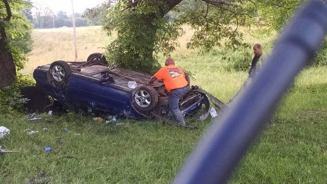 Authorities respond to a flipped car Tuesday morning outside Benton County Sheriff Kenny Christopher's home.