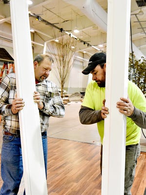 Mike Schultz, left, and Zeb Burke, of Ben Druck Door Company, set up the company's display for the 48th annual York Builders Association's Home & Garden Show at the Utz Arena in Wednesday, Jan. 27, 2016. The show runs Friday 1:00 p.m. - 9:00 p.m.; Saturday 10:00 a.m. - 8:00 p.m. and Sunday 11:00 am - 4:00 pm. The show features 150 exhibitors, added garden displays and kids activities. Admission for up to two days is $8 for adults 18 and older—kids get in free. Dawn J. Sagert