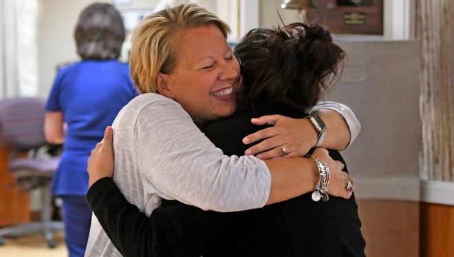 Robin Barrett hugs one of her nurses Monday while visiting OhioHealth Mansfield Hospital.