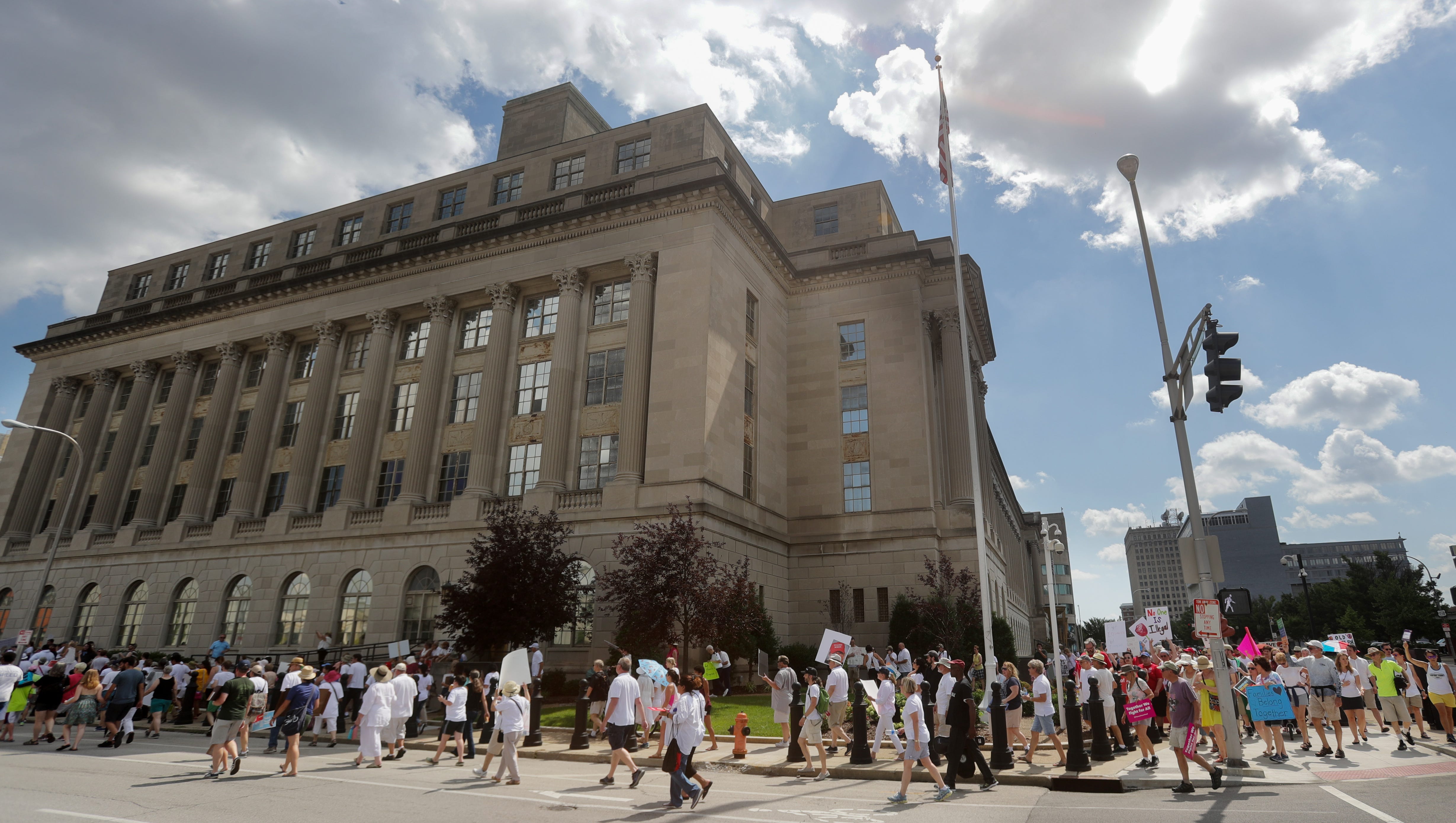 Members of the Families Belong Together rally left