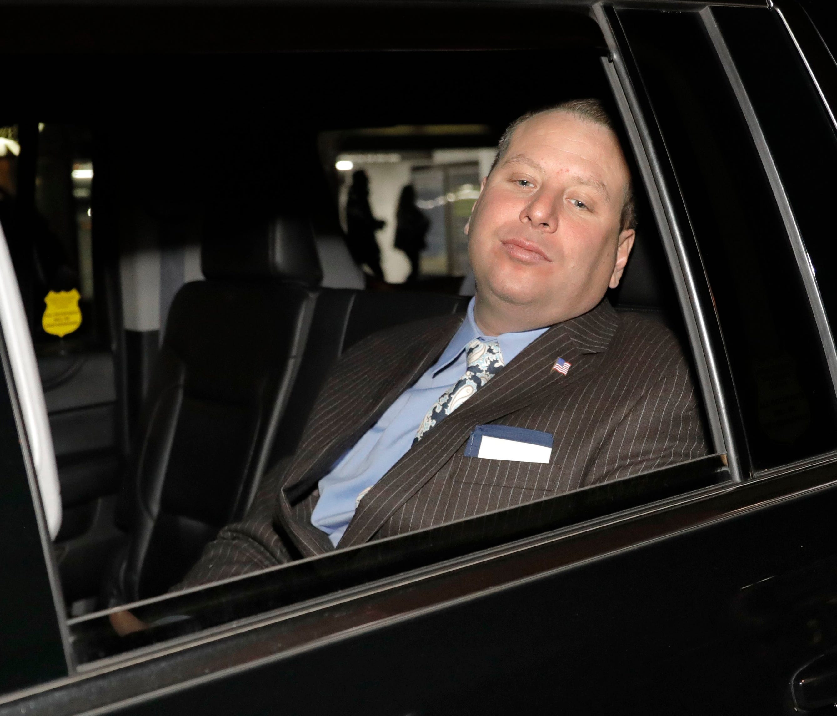 Former Trump campaign aide Sam Nunberg leaves in a car after being interviewed at the CNN News headquarters in New York, on March 5, 2018.