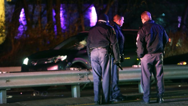 Westchester County police investigate a fatal car accident in which a pedestrian, Hever Latona, 42, of Elmsford, was struck by a car while crossing the Saw Mill River Parkway at Lawrence Street in Dobbs Ferry, Nov. 19, 2014.