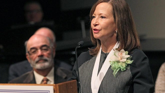 Cathy Sandeen, shown in her inauguration as chancellor of the UW Colleges and UW Extension: The Colleges and Extension would be restructured as the result of a plan the Regents will consider in November.