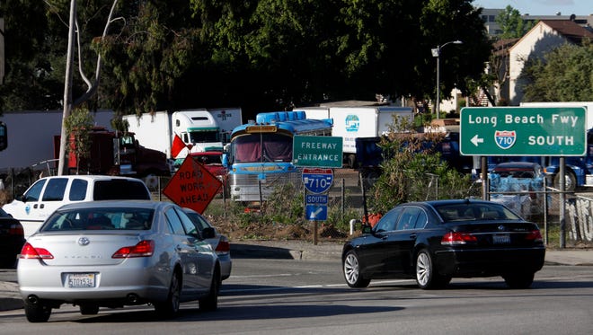 In this file photo, early morning traffic jams the entrance to the 710 Freeway in Alhambra. A proposed 5-mile tunnel linking two Los Angeles-area freeways could be dead after a transit board rejected the idea.
