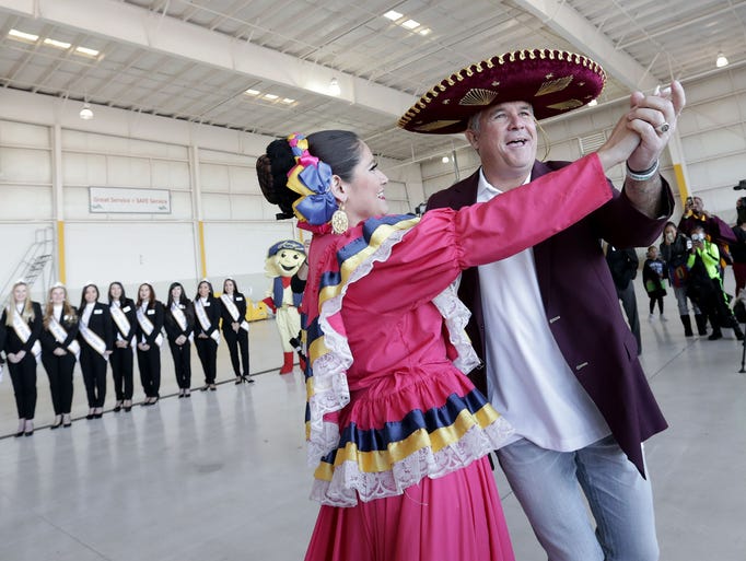 Arizona State head football coach Todd Graham dances
