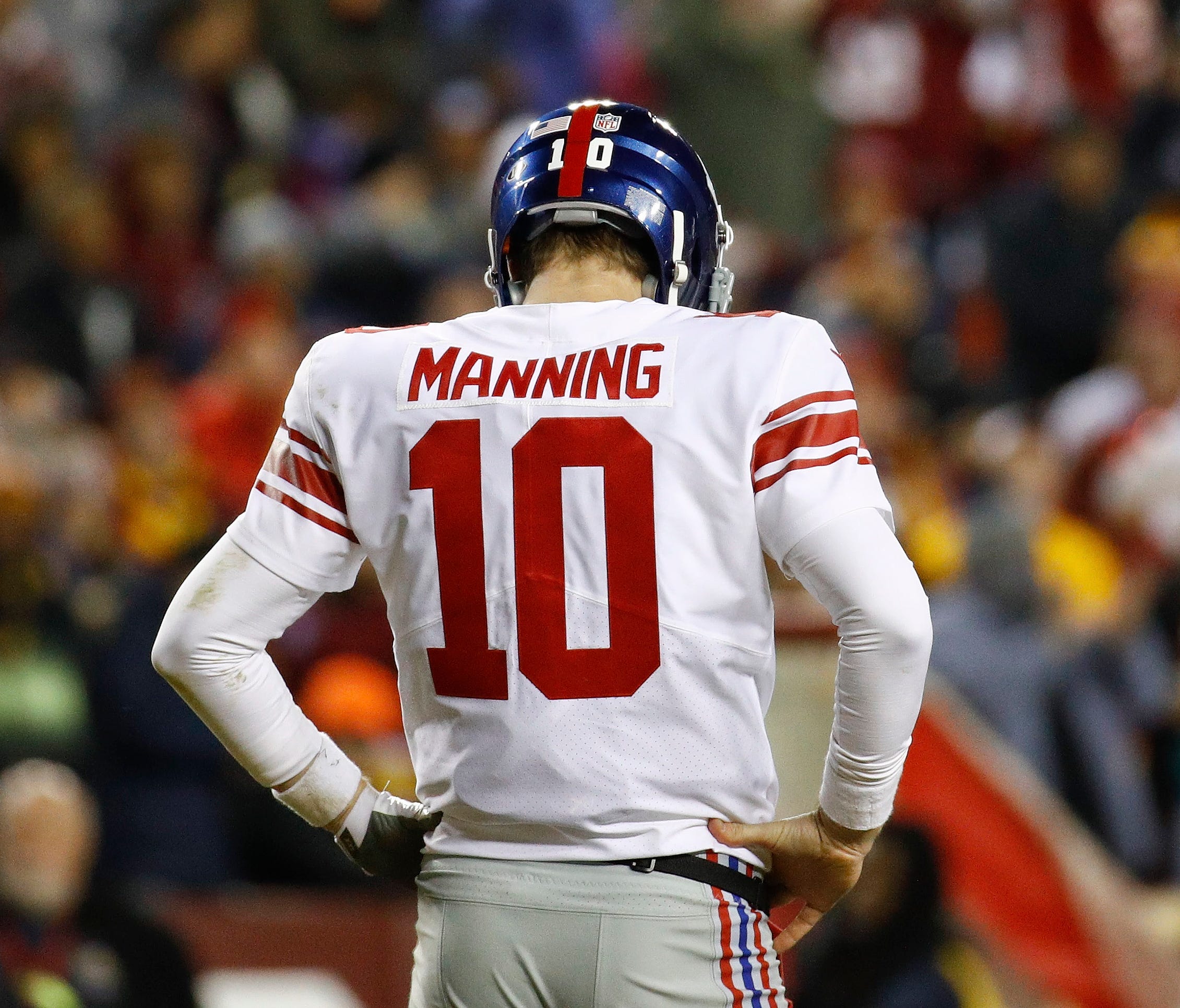 New York Giants quarterback Eli Manning (10) looks down at the turf during the second half of an NFL football game against the Washington Redskins in Landover, Md., Thursday, Nov. 23, 2017. (AP Photo/Patrick Semansky)