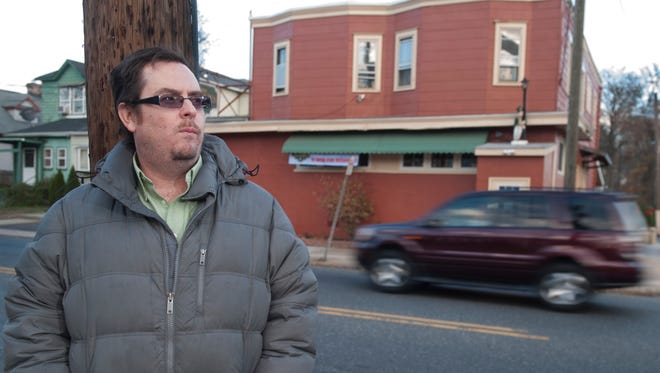 Brian Hickey, a Haddon Township native who is now a journalist living in Philadelphia, stands across from Tom Fischer's Tavern in Haddon Township. Hickey was a victim of a hit and run as he was walking from Tom Fischer's Tavern to the Collingswood PATCO station on Black Friday evening six years ago. 11.20.14