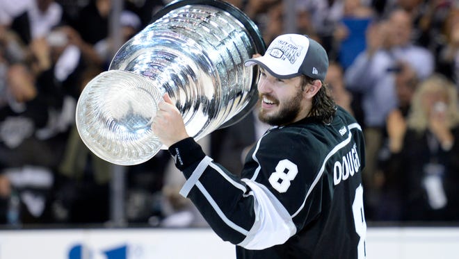 Los Angeles Kings defenseman Drew Doughty is in the spotlight after winning a second Stanley Cup and Olympic gold last season.