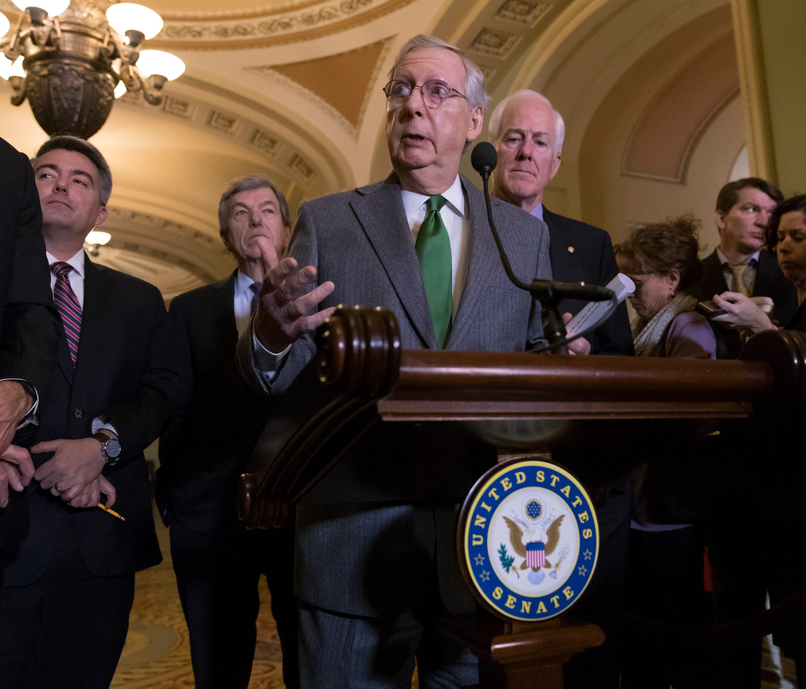 Senate Majority Leader Mitch McConnell, R-Ky., center, joined by other Republicans, speaks to reporters about the GOP tax bill following a closed-door strategy session on Capitol Hill in Washington, Tuesday, Dec. 12, 2017.