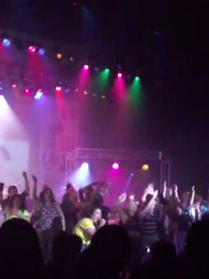 In this image from video provided by Zach Rader students from Westfield High School are on the stage during the grand finale of the concert dubbed "American Pie" Thursday April 23, 2015 just prior to the stage collapsed.