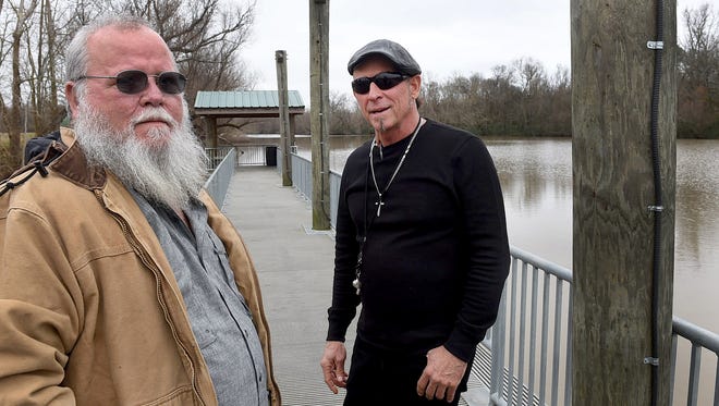 Leo Martin, left, Cajun Navy Relief member, and musician Vaughn Goudeaux discuss the upcoming Cajun Navy Relief training exercise to be held at Henderson Swamp.