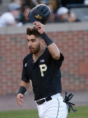 Nick Dalesandro of Purdue tips his helmet to Boilermaker faithful after scoring on a single by Ben Nisle in the bottom of the third inning against Indiana Wednesday, April 25, 2018, at Alexander Field.