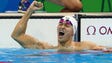 Yang Sun (CHN) celebrates after winning the men's 200m
