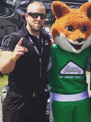 Plymouth native Seth Kimberlin poses for a photo with “Tricky the Fox” from Pocono.