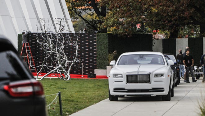 
Rolls Royces and other luxury automobiles were parked on set of Batman v Superman at the Eli Broad Museum in East Lansing as workers set up a red carpet scene.
