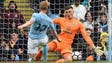 Burnley goalkeeper Nick Pope saves a shot from Manchester
