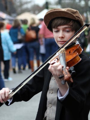 Tiny Tim playing the violin at Dickens of a Christmas 2015.
