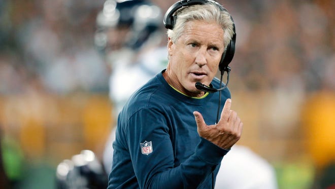 Seattle Seahawks head coach Pete Carroll argues a call during the first half of an NFL football game against the Green Bay Packers in Green Bay, Wis. The Seahawks  have the 26th pick in the first round in next week's NFL draft in Chicago.