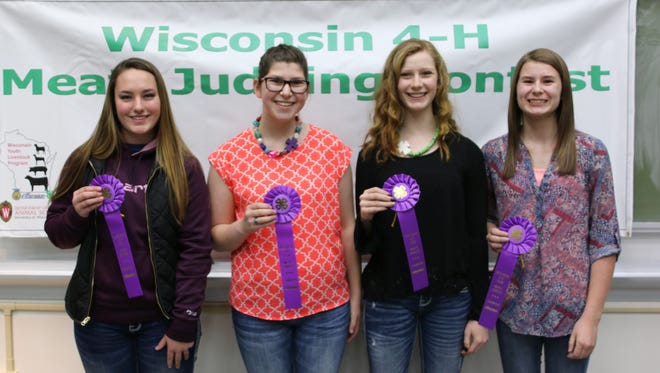 The team from Marathon County from left, Emilie Pauls, Stephanie Witberler, Kailen Smercheck and Cortney Zimmerman captured top honors in the senior division at the 4-H State Meats judging contest. They are coached by Mark Zimmerman.
