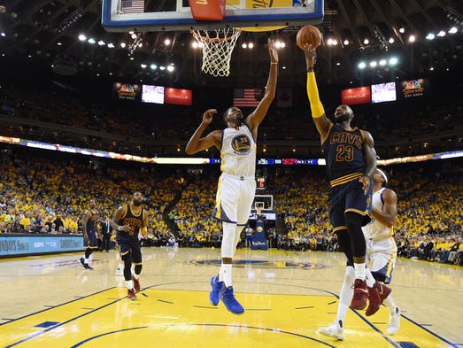 LeBron James shoots over Kevin Durant in the second