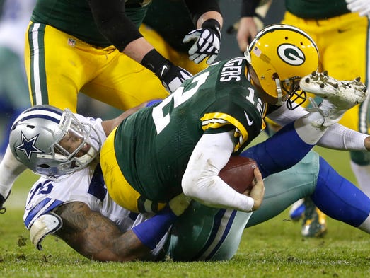 Green Bay Packers quarterback Aaron Rodgers is sacked